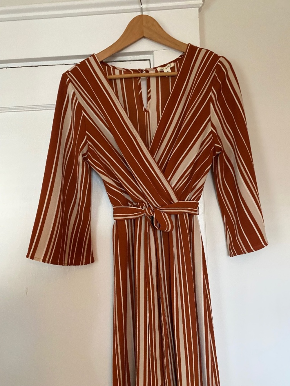Striped jumpsuit with palazzo pants and wrap top